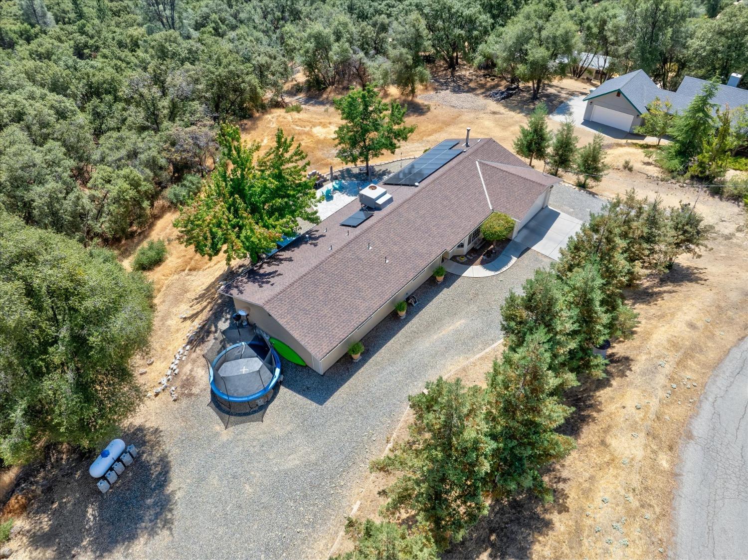 41175 Jean Road West Oakhurst, CA 93644 - Photo 39 of 43 an aerial view of a house yard and swimming pool