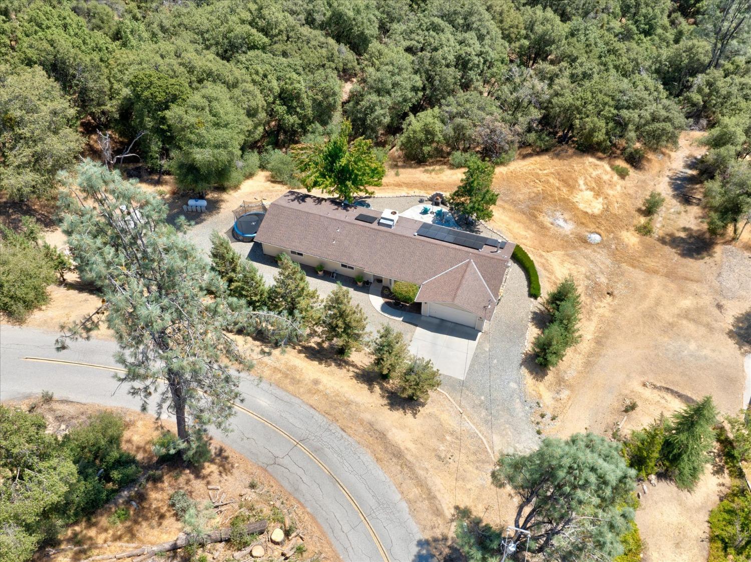 41175 Jean Road West Oakhurst, CA 93644 - Photo 40 of 43 an aerial view of house with yard and mountain view in back