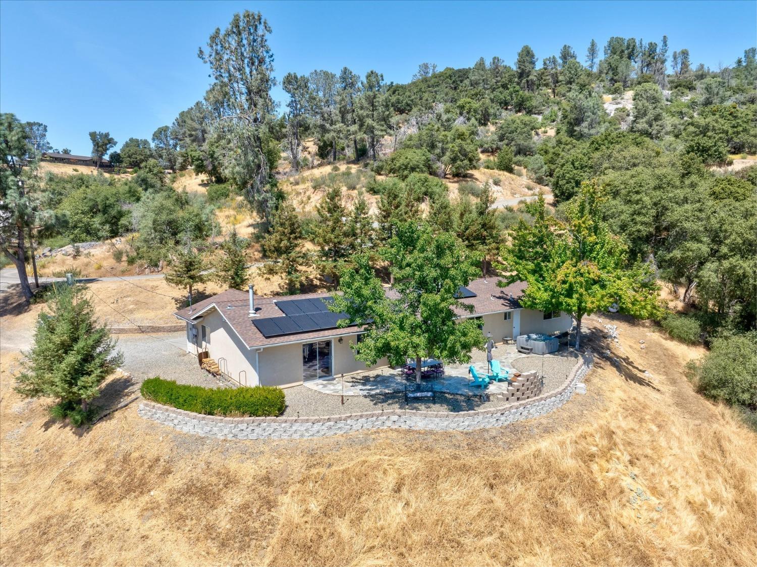 41175 Jean Road West Oakhurst, CA 93644 - Photo 42 of 43 a view of a backyard with plants and a patio