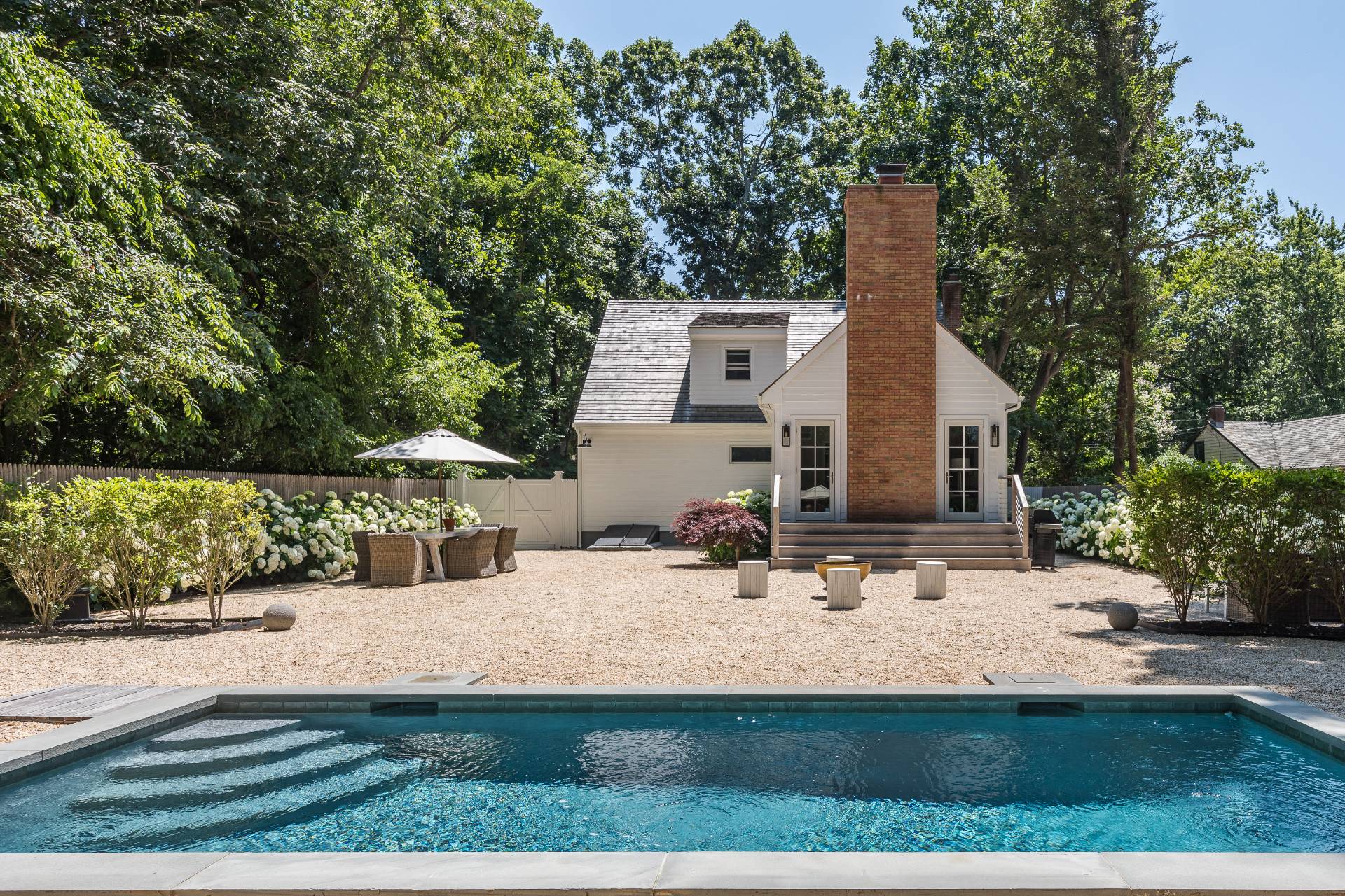 1253 Brick Kiln Road Sag Harbor, NY 11963 - Photo 12 of 31 a view of house with yard outdoor seating and covered with trees