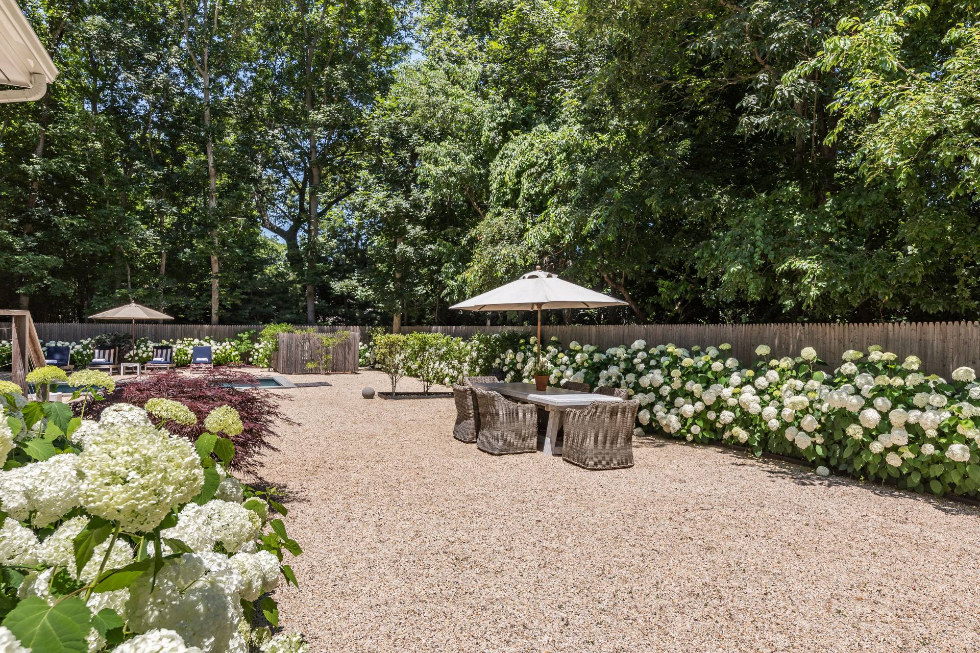 1253 Brick Kiln Road Sag Harbor, NY 11963 - Photo 16 of 31 a view of a backyard with potted plants