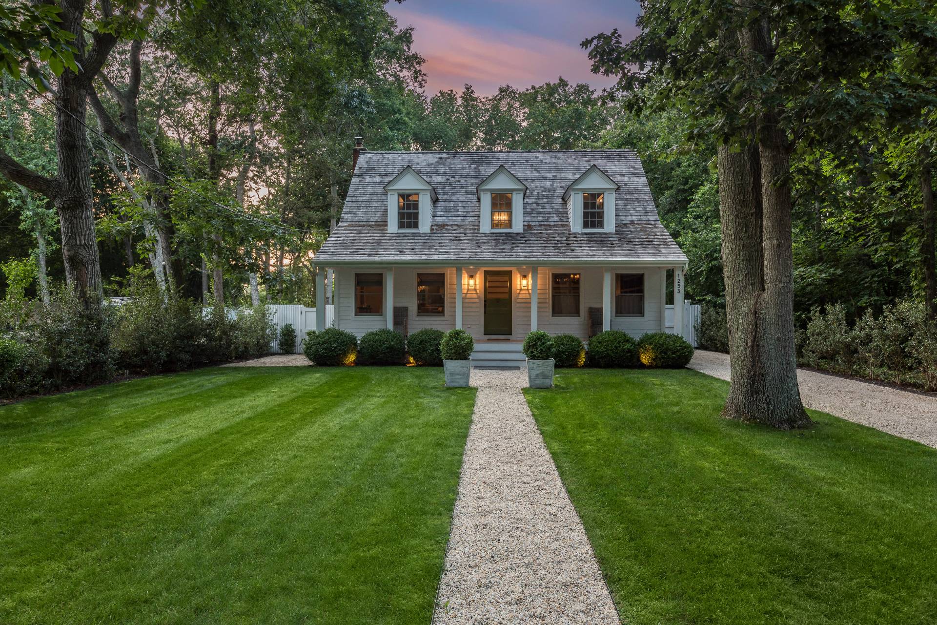 1253 Brick Kiln Road Sag Harbor, NY 11963 - Photo 2 of 31 a front view of a house with a yard