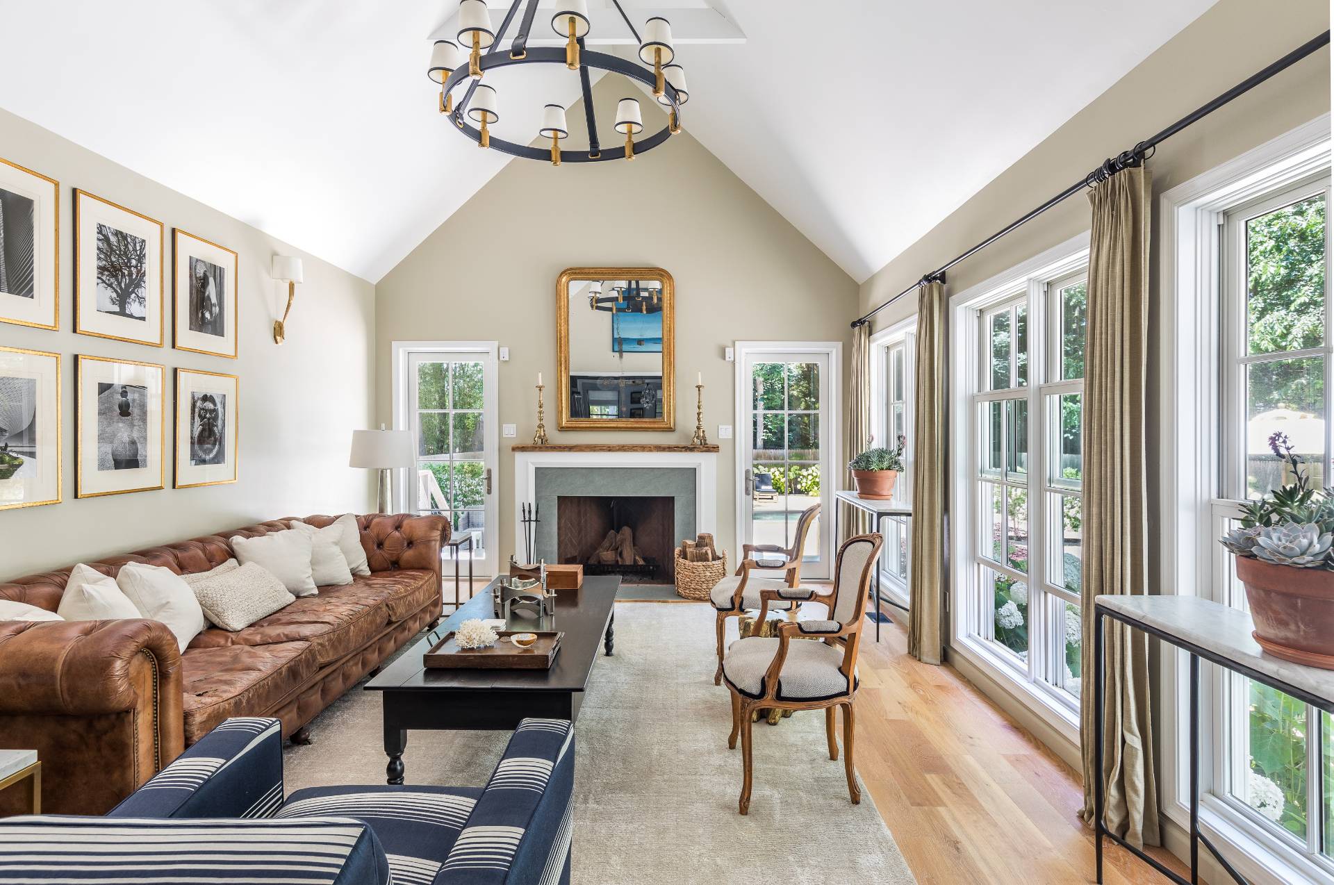 1253 Brick Kiln Road Sag Harbor, NY 11963 - Photo 22 of 31 a living room with furniture a fireplace and a large window