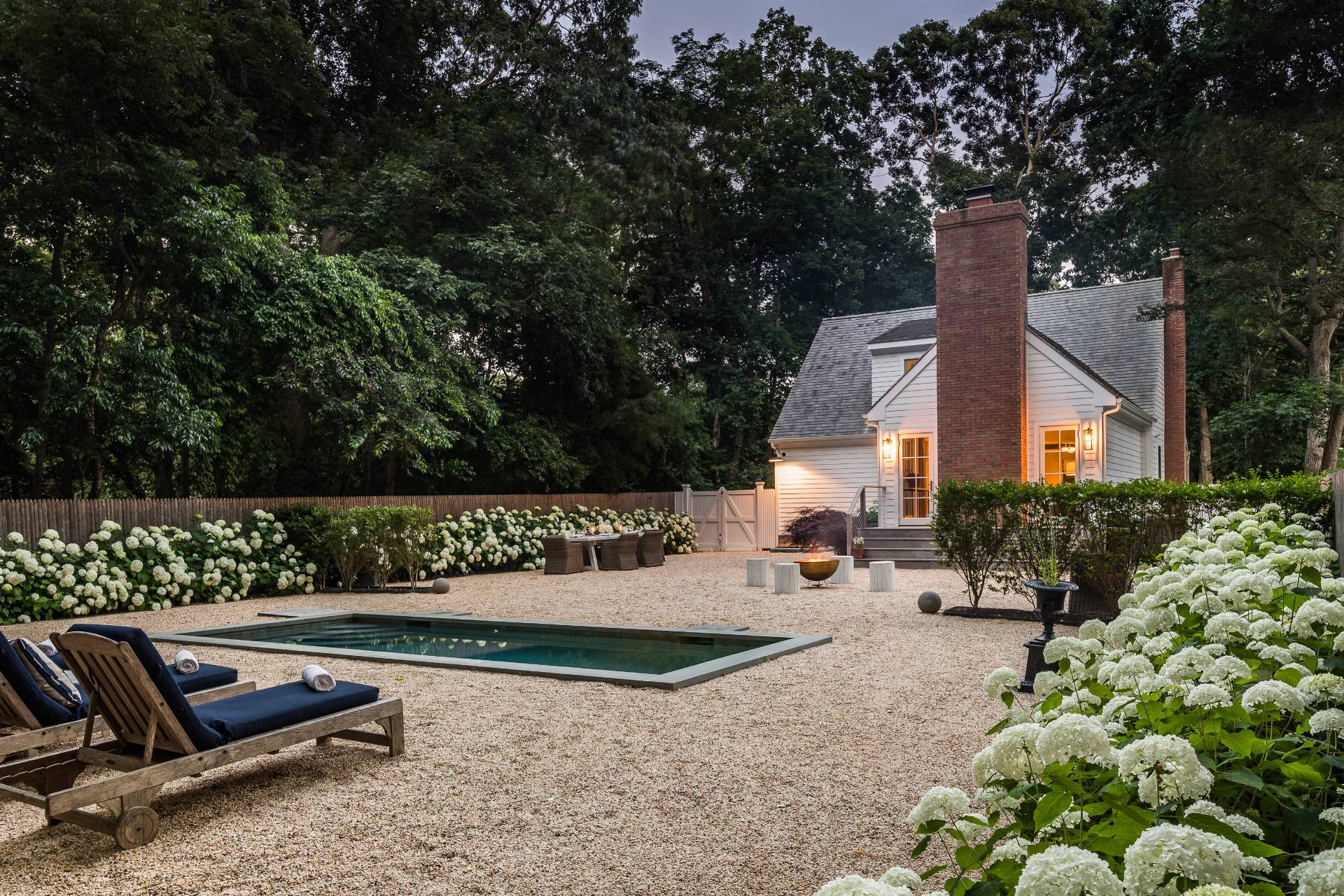 1253 Brick Kiln Road Sag Harbor, NY 11963 - Photo 4 of 31 a view of a bench in back yard of the house