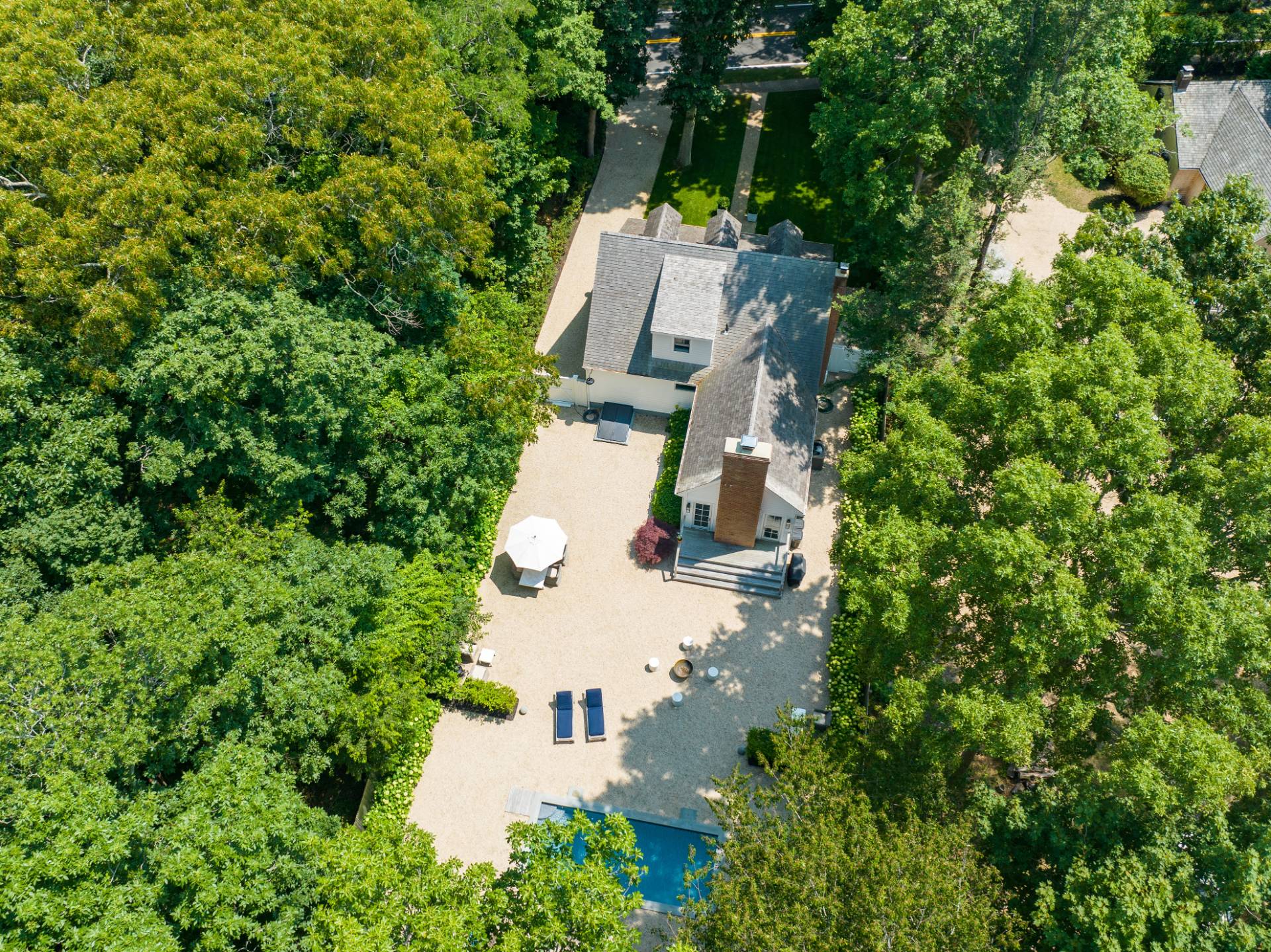1253 Brick Kiln Road Sag Harbor, NY 11963 - Photo 9 of 31 an aerial view of a house with a yard and trees all around