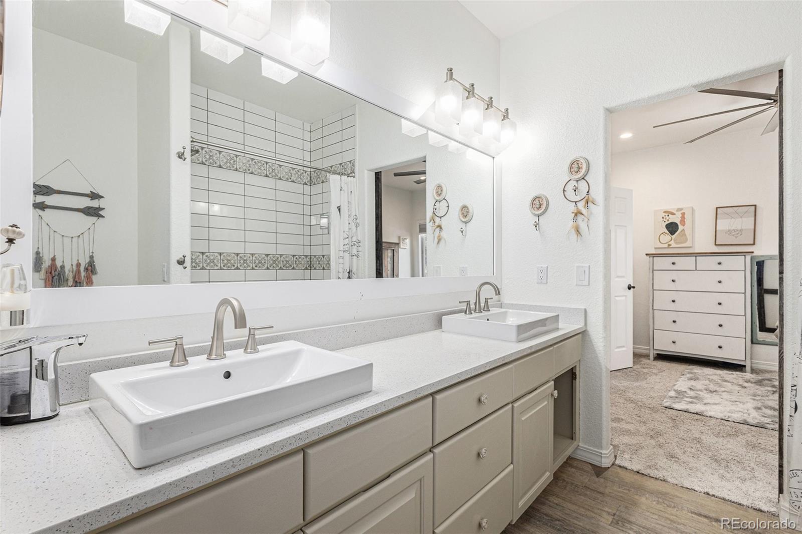17870 New London Road Monument, CO 80132 - Photo 18 of 44 a bathroom with a sink double vanity