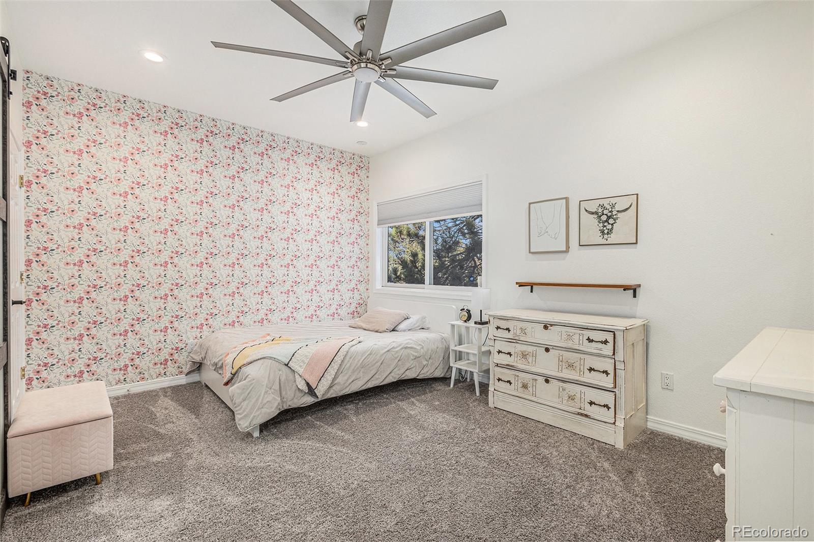 17870 New London Road Monument, CO 80132 - Photo 19 of 44 a bedroom with a bed and a couch