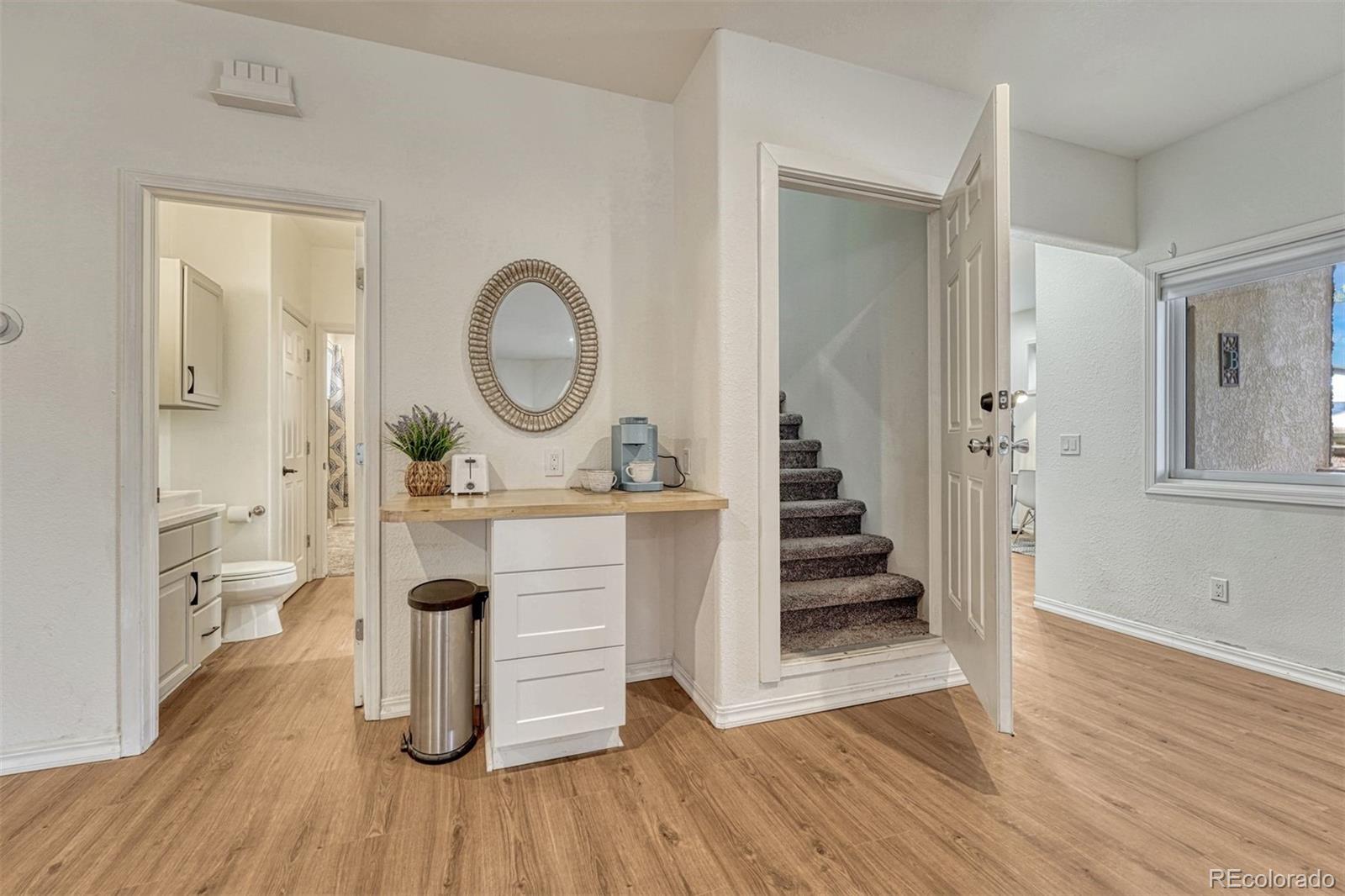 17870 New London Road Monument, CO 80132 - Photo 21 of 44 a living room with furniture and a wooden floor