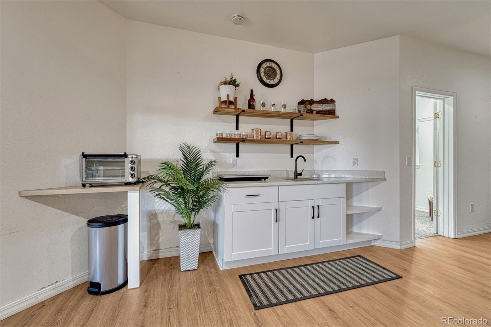 17870 New London Road Monument, CO 80132 - Photo 23 of 44 a kitchen with a sink and a stove
