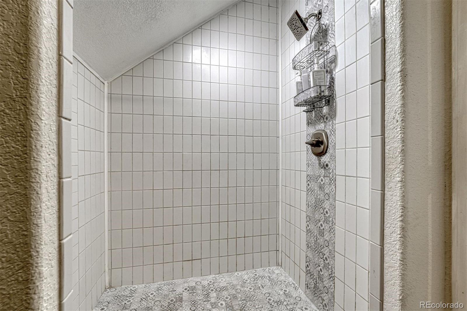 17870 New London Road Monument, CO 80132 - Photo 35 of 44 a bathroom with a shower