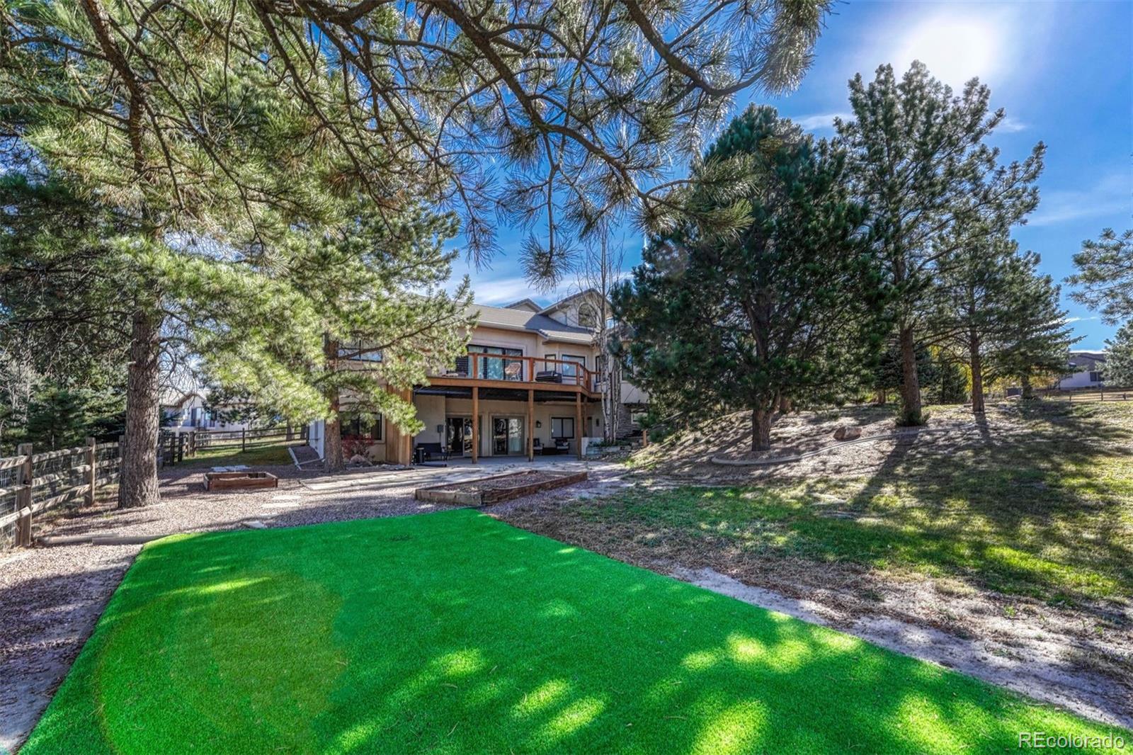 17870 New London Road Monument, CO 80132 - Photo 5 of 44 a building with trees in front of it