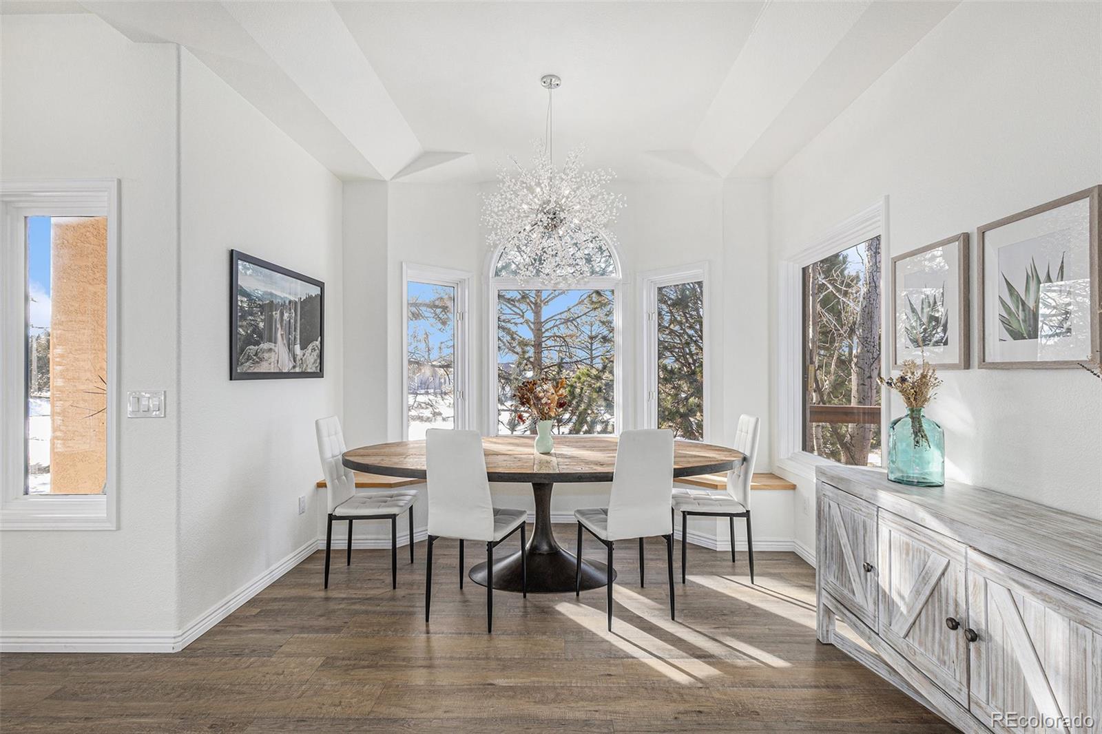 17870 New London Road Monument, CO 80132 - Photo 6 of 44 a view of a livingroom with furniture window and wooden floor