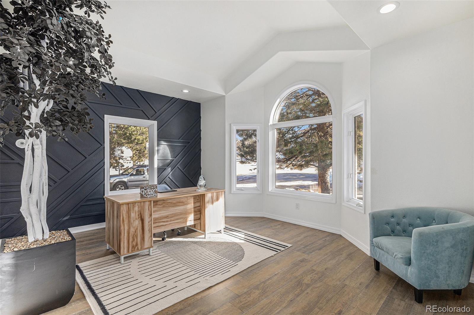 17870 New London Road Monument, CO 80132 - Photo 7 of 44 a living room with furniture and a large window