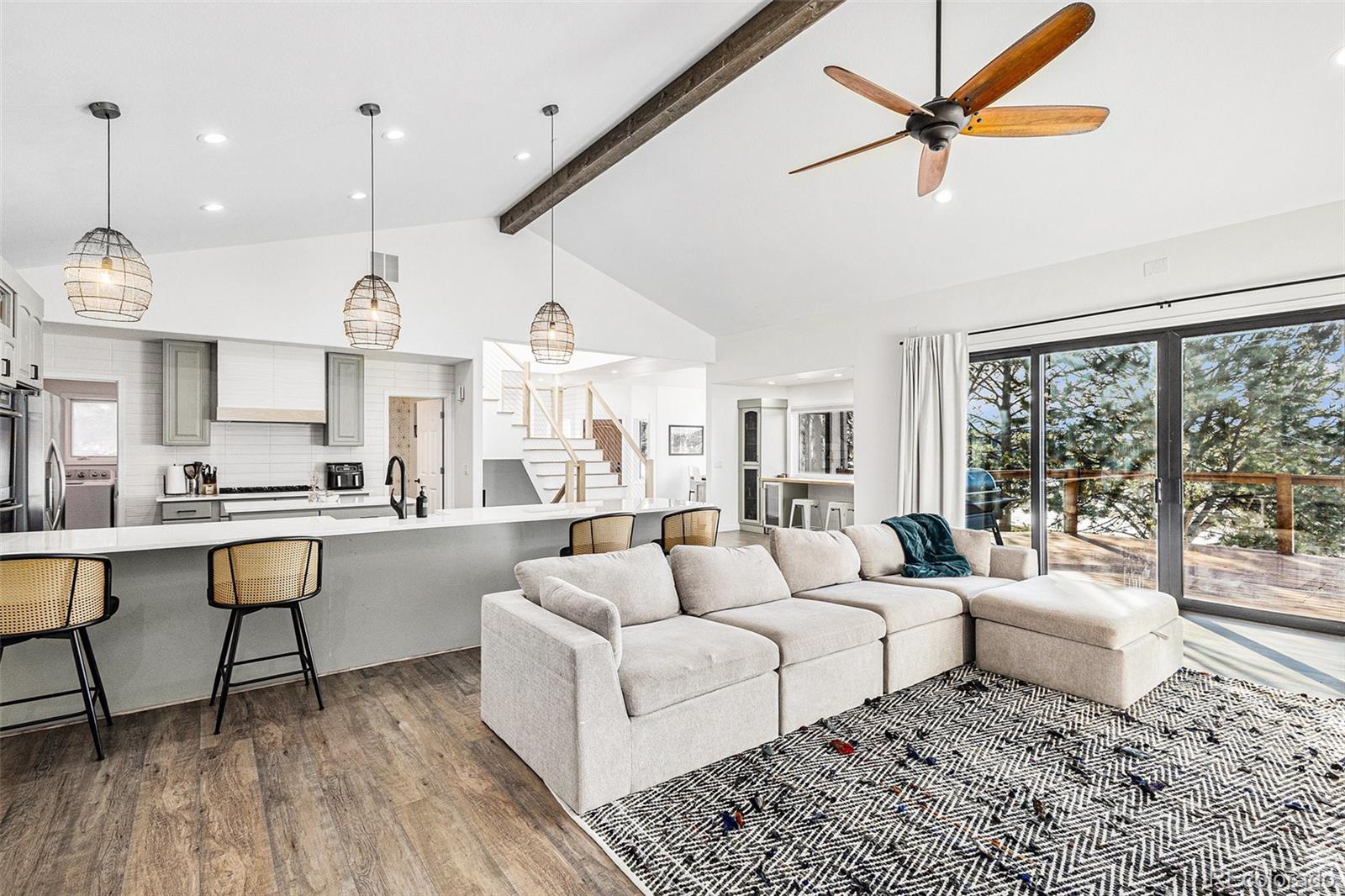 17870 New London Road Monument, CO 80132 - Photo 8 of 44 a living room with furniture and a large window
