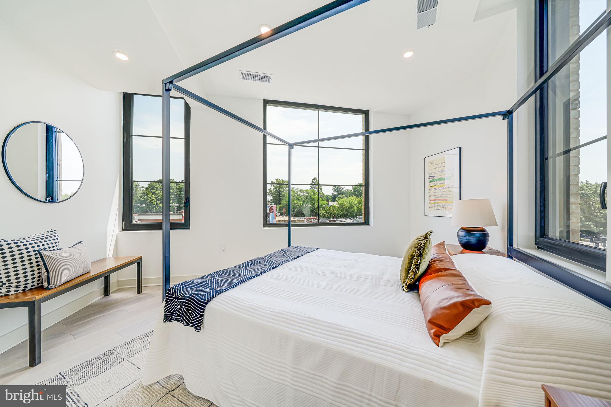 2901 Newark Street Northwest Washington, DC 20008 - Photo 17 of 52 a bedroom with a bed and a large window