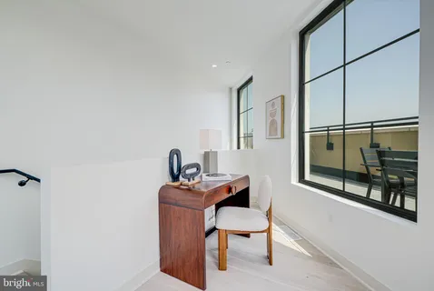 a reading room with furniture and wooden floor