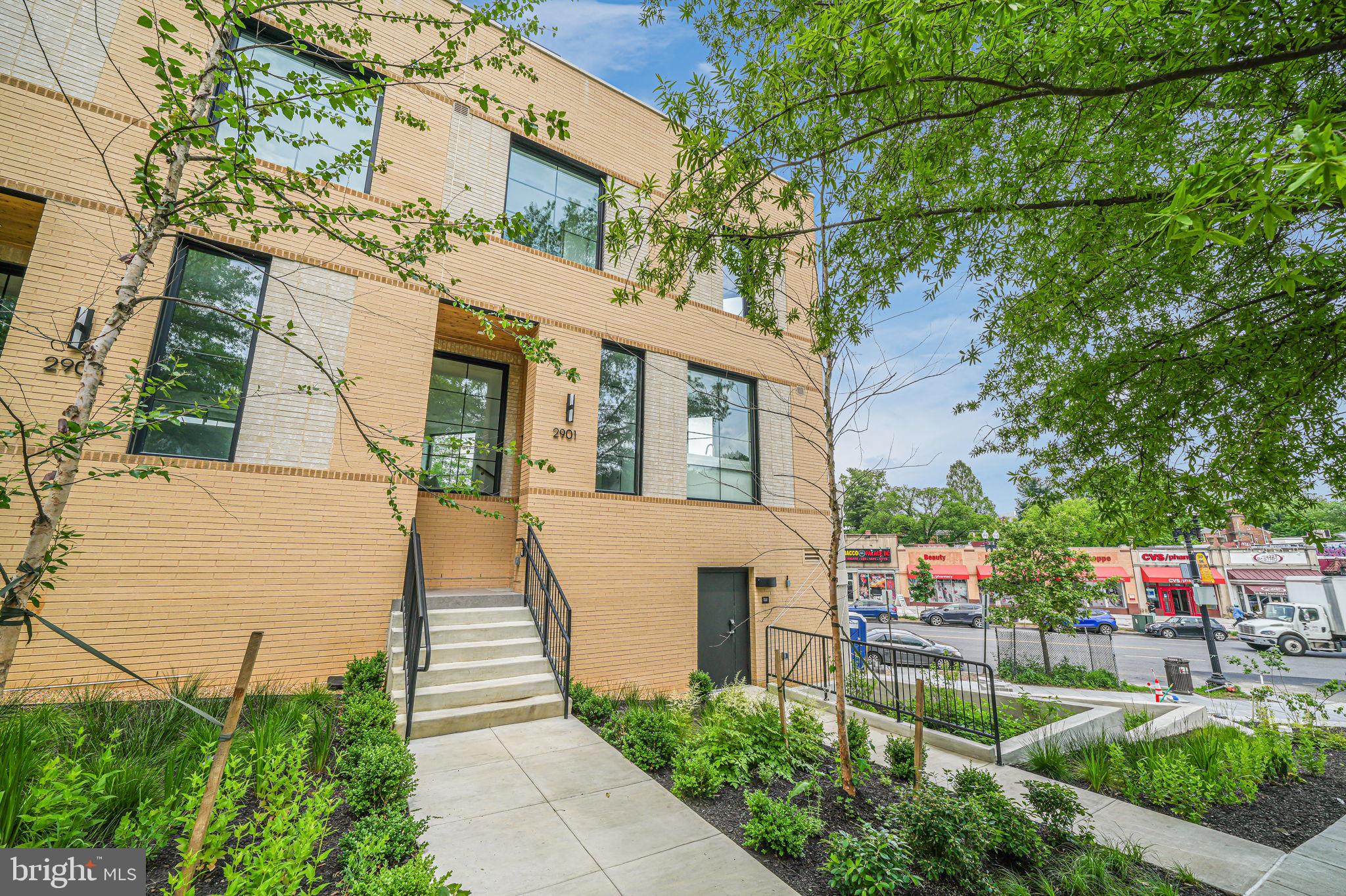 2901 Newark Street Northwest Washington, DC 20008 - Photo 24 of 52 a front view of a house with garden
