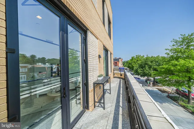 a balcony with view of outdoor space