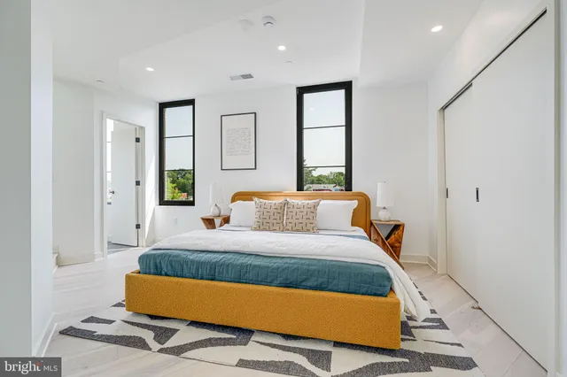 a bedroom with a bed and window