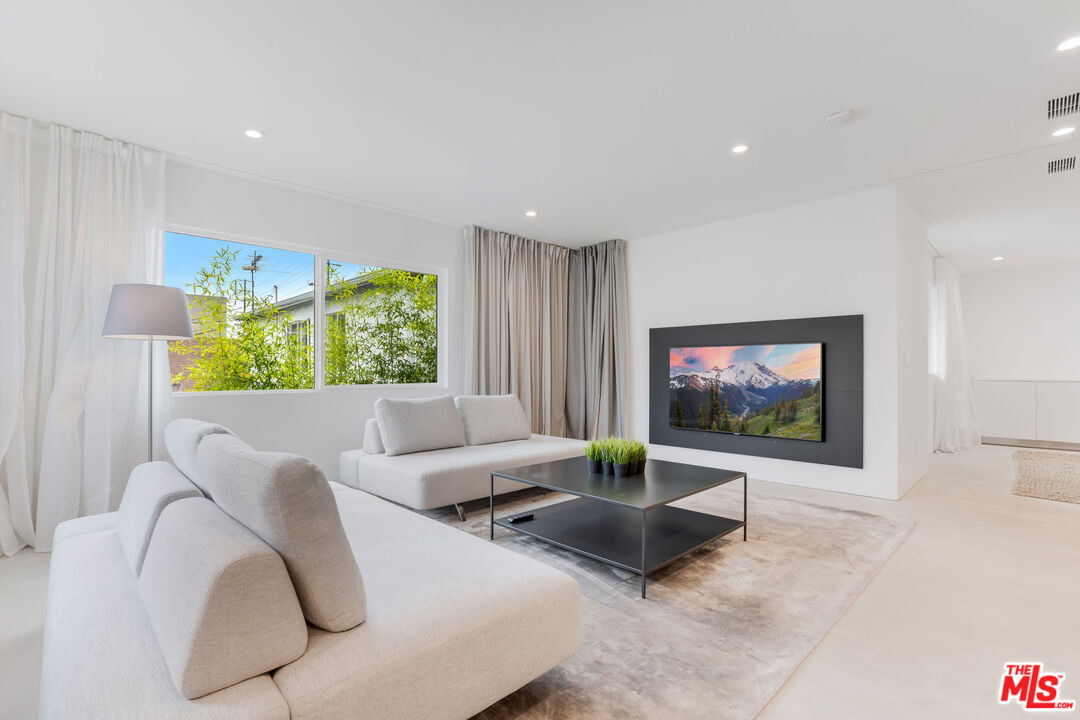 Undisclosed Address Los Angeles, CA 90064 - Photo 14 of 25 a living room with furniture and a flat screen tv
