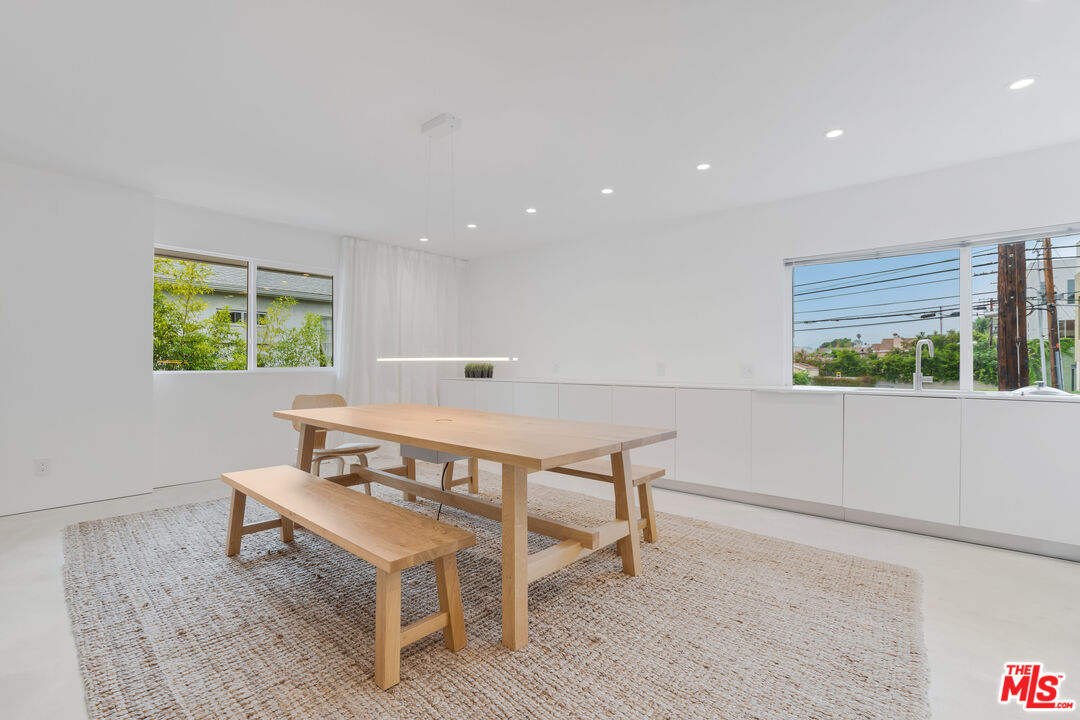 Undisclosed Address Los Angeles, CA 90064 - Photo 16 of 25 a living room with a table and a window