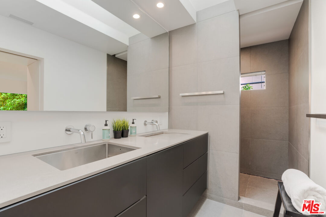 Undisclosed Address Los Angeles, CA 90064 - Photo 17 of 25 a bathroom with a sink and a mirror