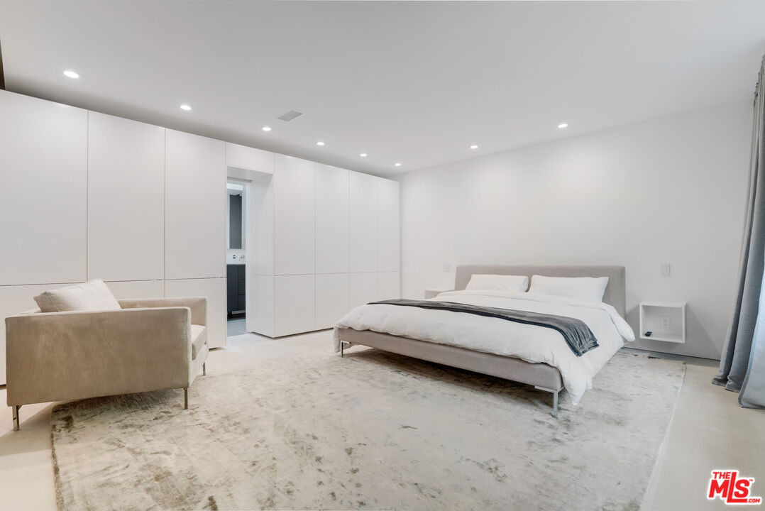 Undisclosed Address Los Angeles, CA 90064 - Photo 18 of 25 a spacious bedroom with a bed and a couch