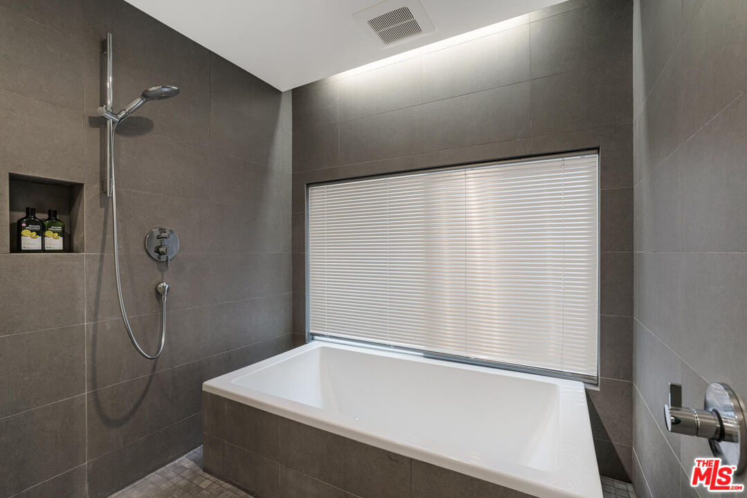 Undisclosed Address Los Angeles, CA 90064 - Photo 10 of 25 a bathroom with a shower and a sink