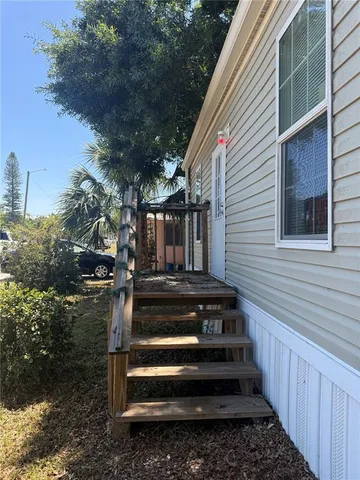 a kitchen with granite countertop a stove a sink and a refrigerator