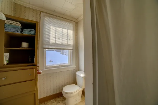 a bathroom with a toilet