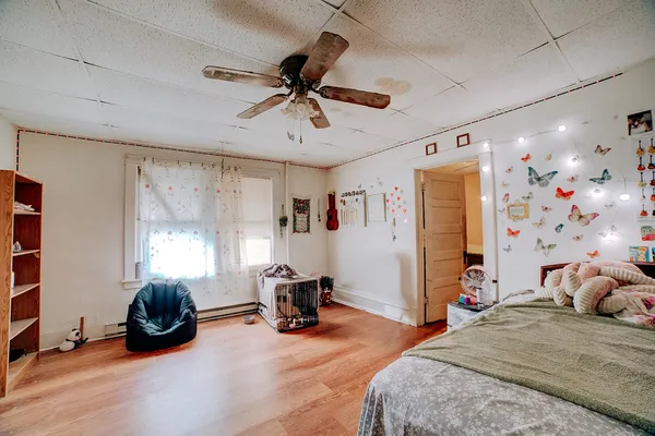 a bedroom with furniture and a window