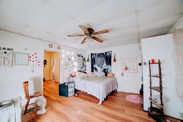 a bedroom with a bed and a window