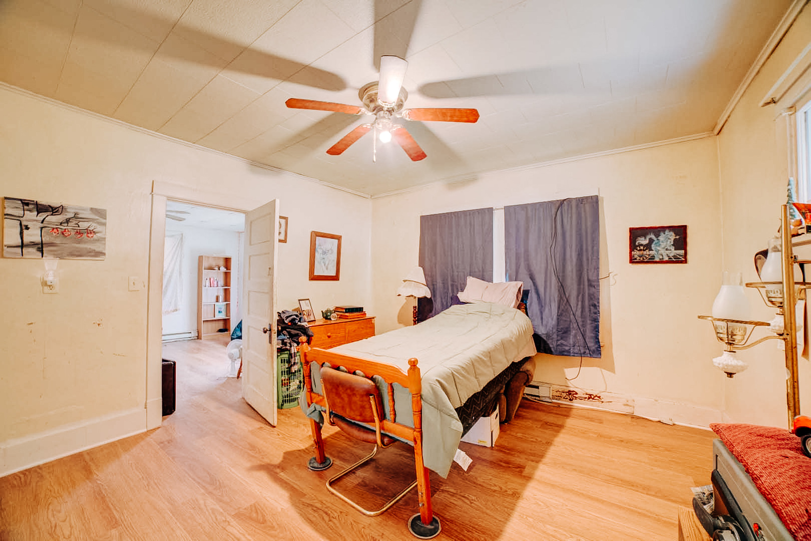 215 South 3rd Street Watseka, IL 60970 - Photo 8 of 17 a bedroom with a bed and a chandelier