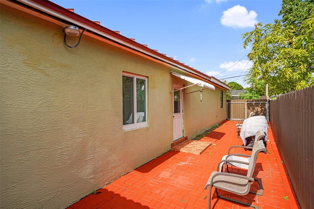413 Northwest 100th Terrace Miami, FL 33150 - Photo 18 of 29 a backyard of a house with seating space