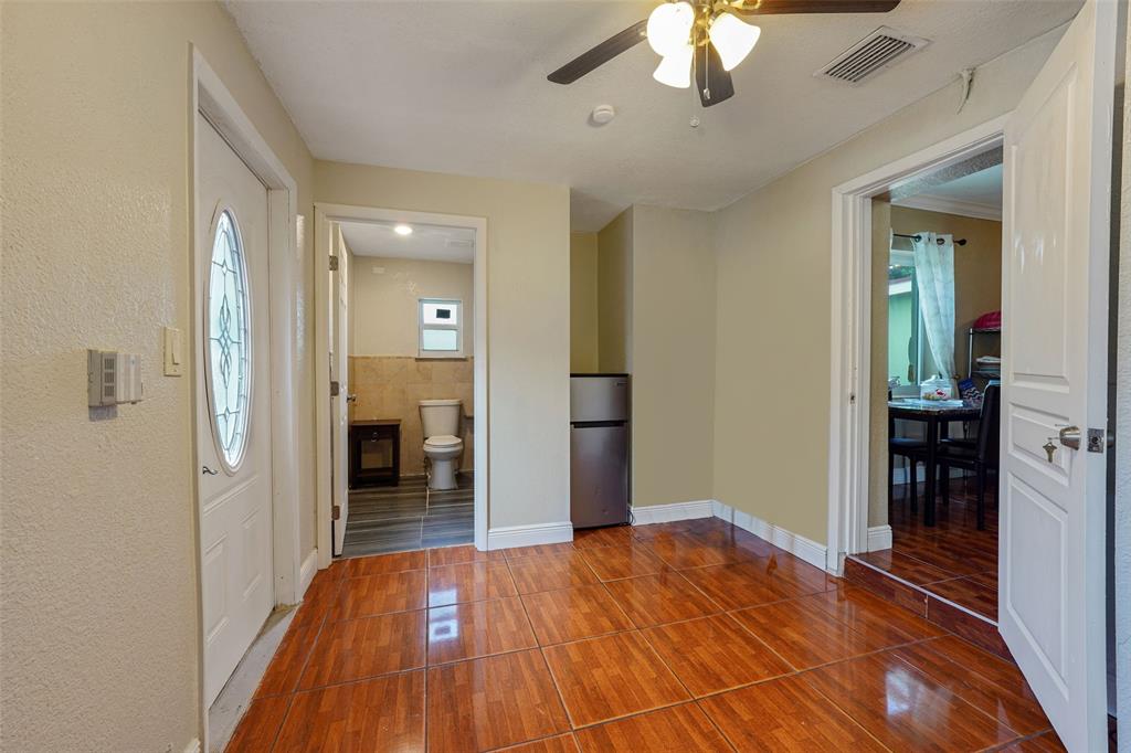 413 Northwest 100th Terrace Miami, FL 33150 - Photo 24 of 29 wooden floor in an empty room and a kitchen