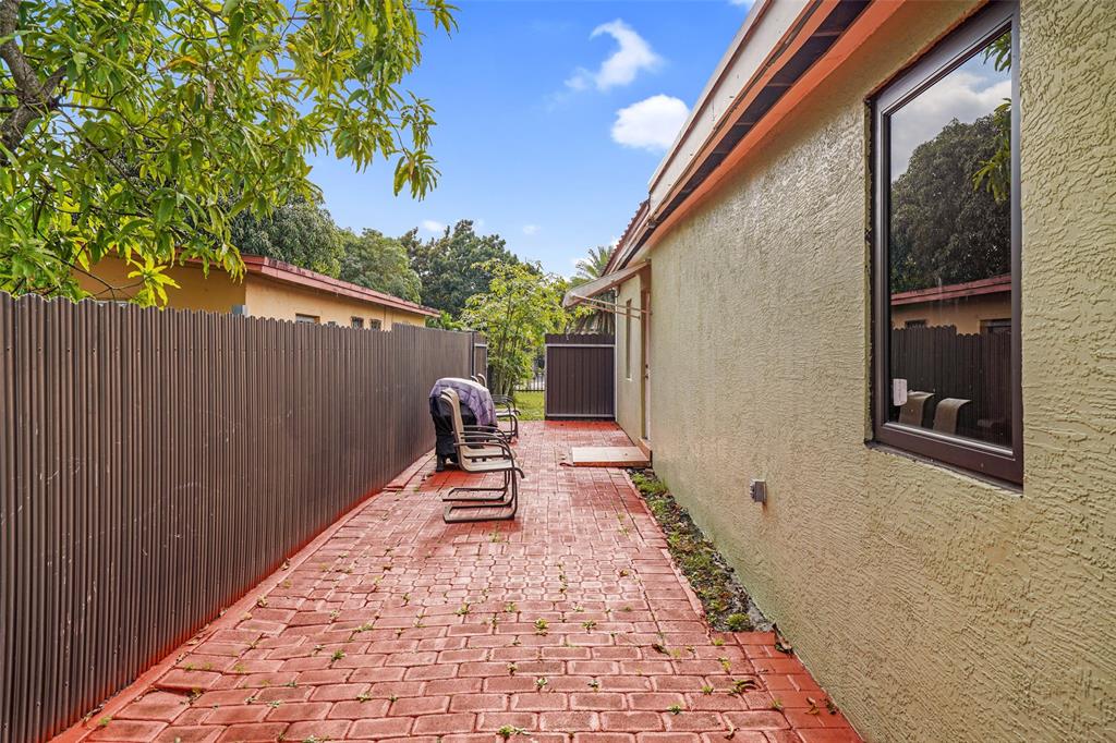 413 Northwest 100th Terrace Miami, FL 33150 - Photo 27 of 29 a chairs and a table in the balcony