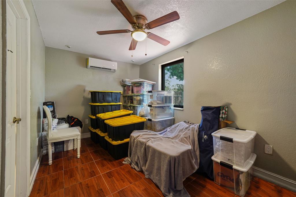 413 Northwest 100th Terrace Miami, FL 33150 - Photo 6 of 29 a living room with furniture a ceiling fan and a rug