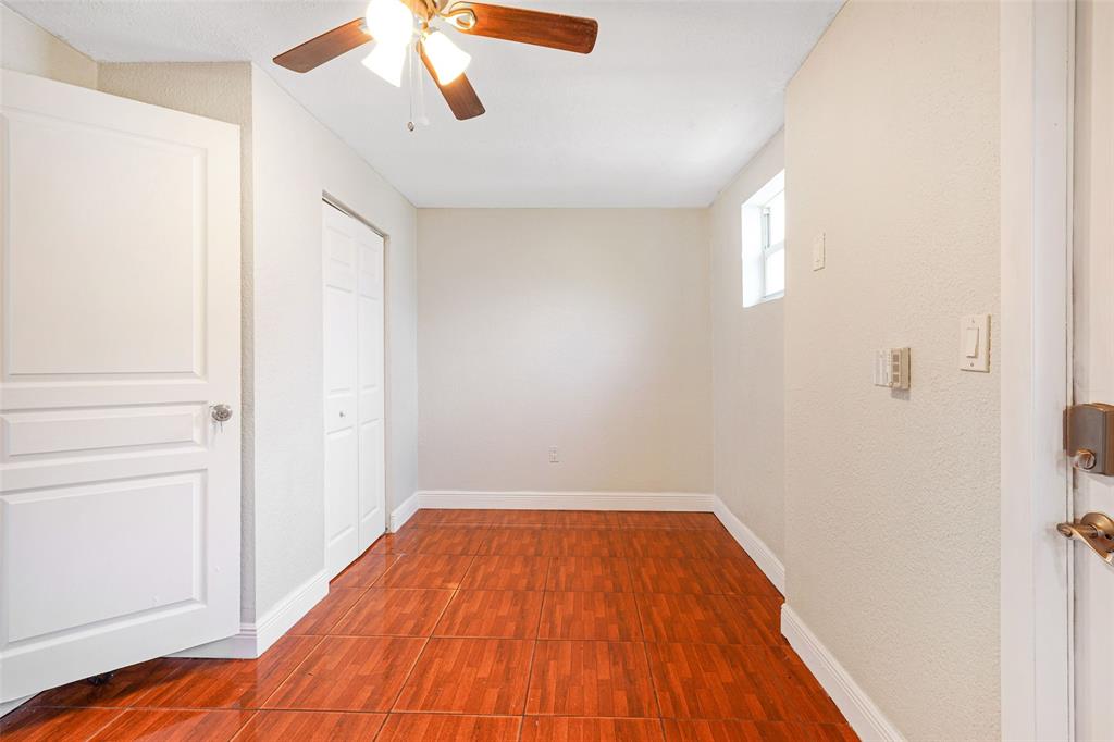413 Northwest 100th Terrace Miami, FL 33150 - Photo 8 of 29 a view of a room with wooden floor and fan