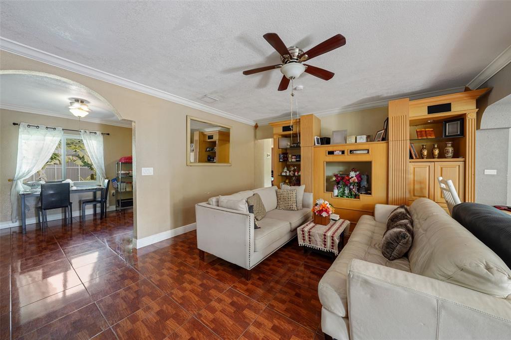413 Northwest 100th Terrace Miami, FL 33150 - Photo 10 of 29 a living room with furniture and a large window