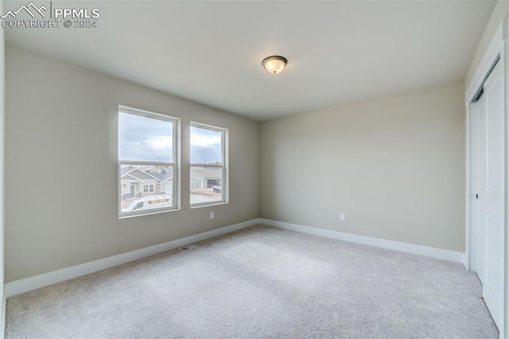 205 High Meadows Drive Florence, CO 81226 - Photo 32 of 49 an empty room with a window