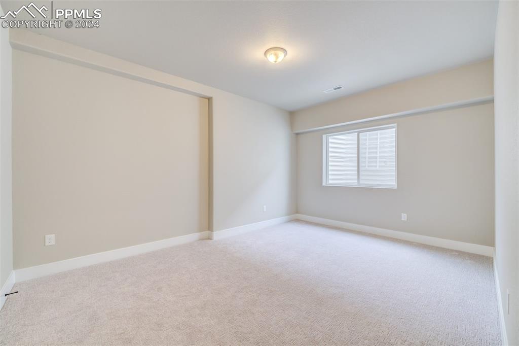 205 High Meadows Drive Florence, CO 81226 - Photo 40 of 49 an empty room with windows