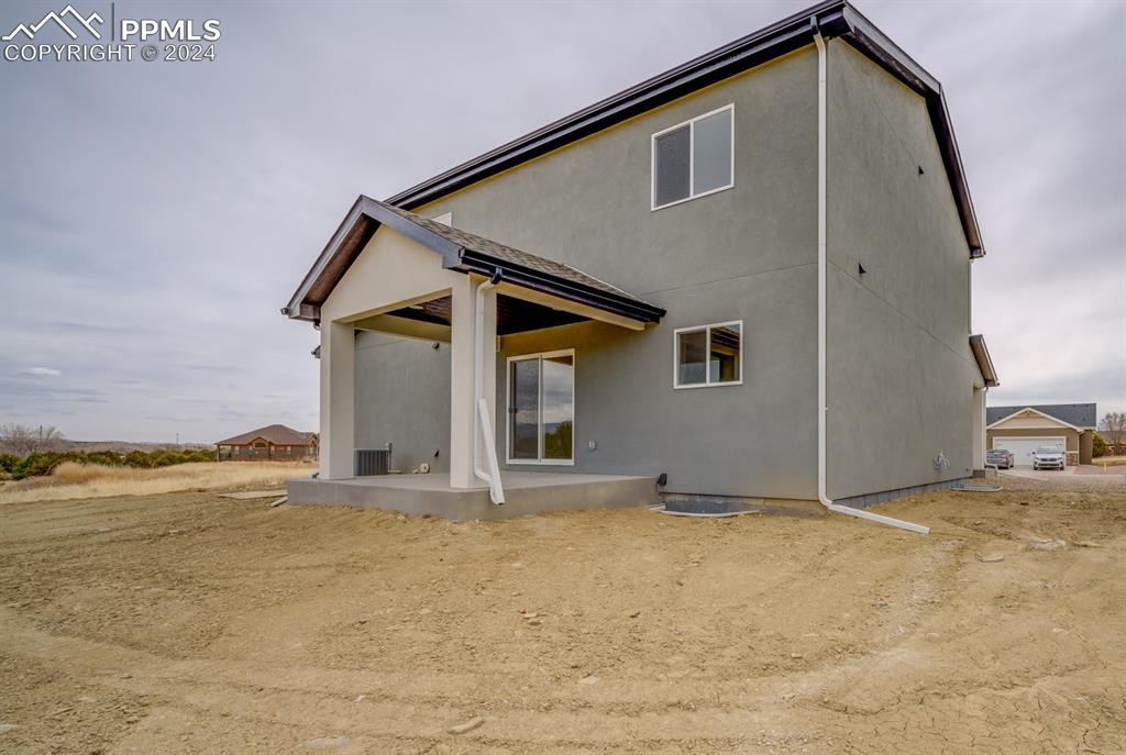 205 High Meadows Drive Florence, CO 81226 - Photo 47 of 49 a view of an house with backyard