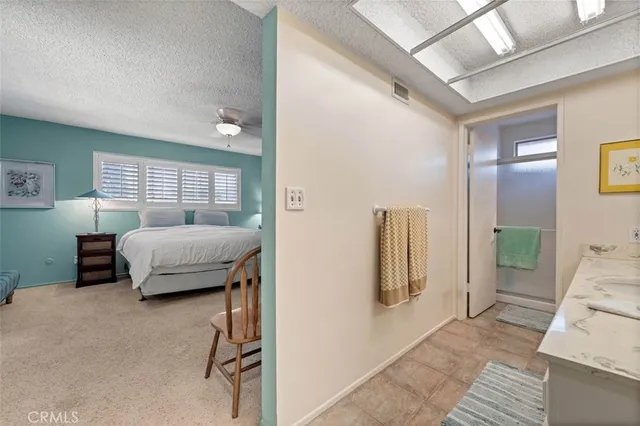 a bedroom with furniture and a window