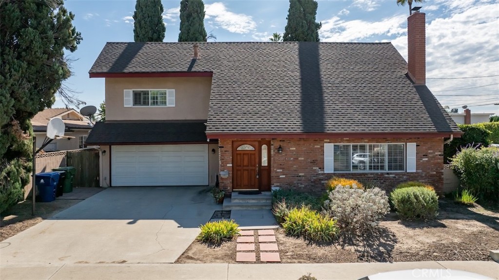 15410 Runnymede Street Van Nuys, CA 91406 - Photo 22 of 22 a front view of a house with garden