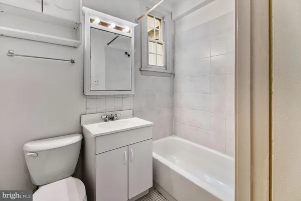 a bathroom with a toilet a sink and a bathtub