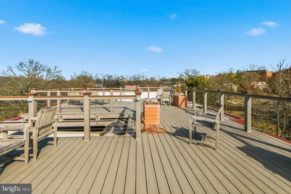 a view of roof deck with patio