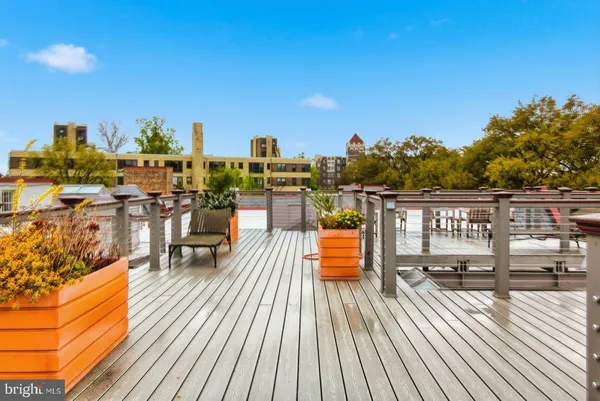 a view of roof deck with patio