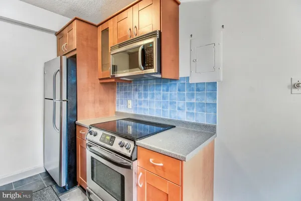 a kitchen with a stove and a microwave