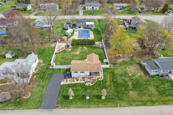 an aerial view of a houses with outdoor space