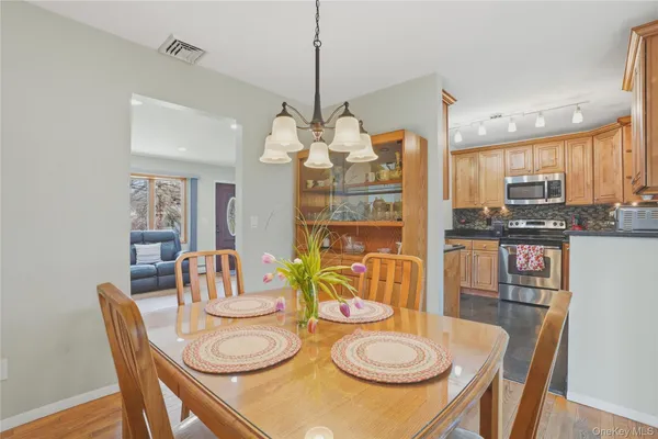 a dining room with furniture and window